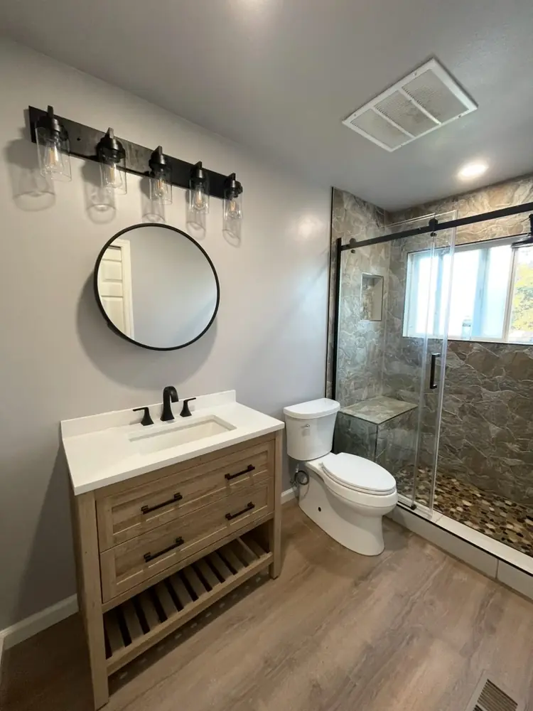 Finished bathroom remodel with new vanity and glass shower