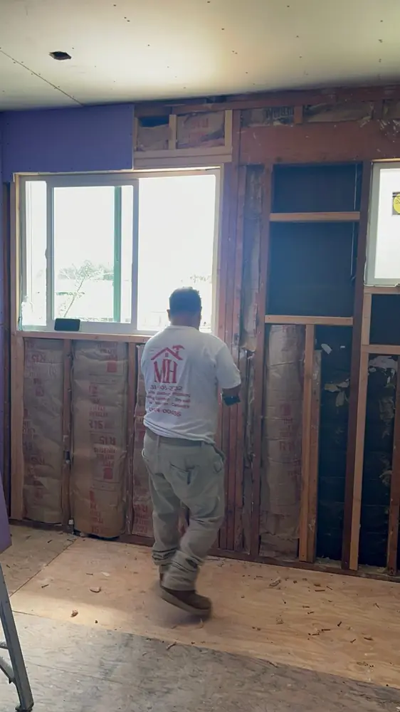 Mario framing a wall during a remodel